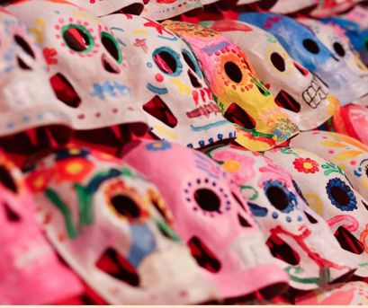 Sugar Skull Masks painted by students participating in a Latino Arts Gallery Workshop