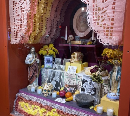 Day of the Dead display behind a glass case