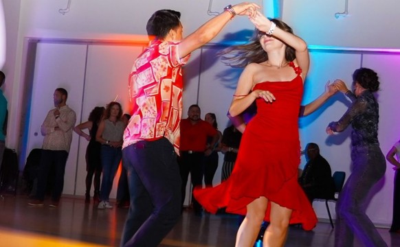 Photo of Salsa dancers on the floor dancing